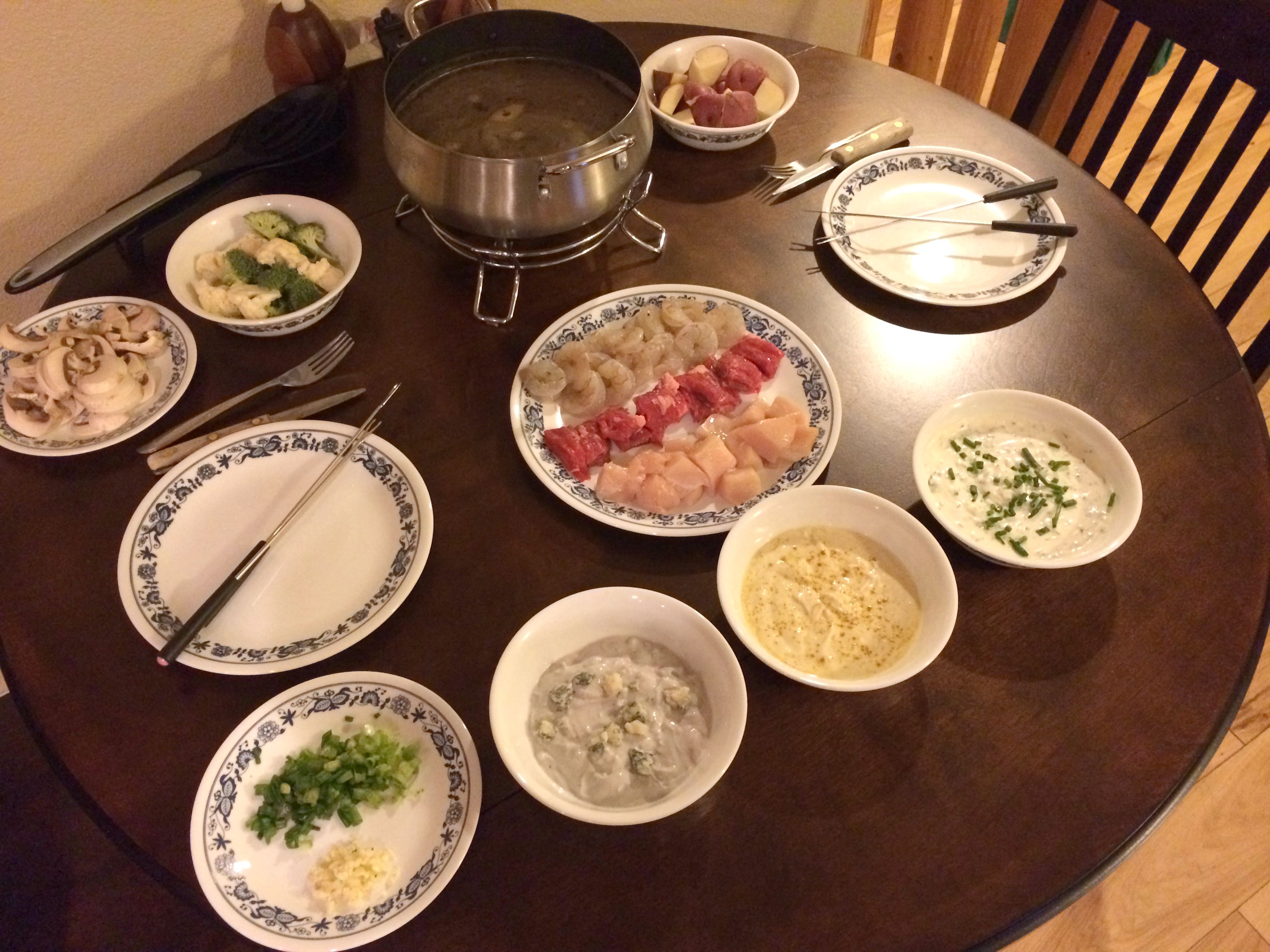 Fondue: Cooking Broth with Proteins, Veggies, & Dipping Sauces